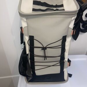 Rains Cream and Black Backpack Roll-Top Design